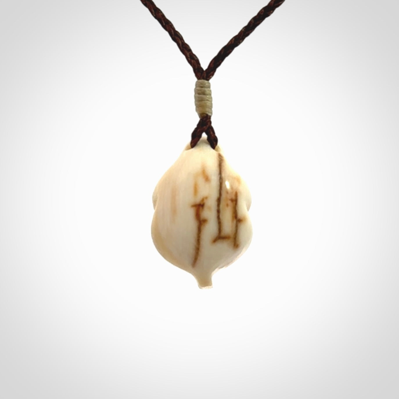 Hand carved mammoth tusk goddess pendant. Hand carved Mammoth Tusk jewellery for sale online by NZ Pacific. Delivered with a fine adjustable cord and packaged in a woven kete pouch.