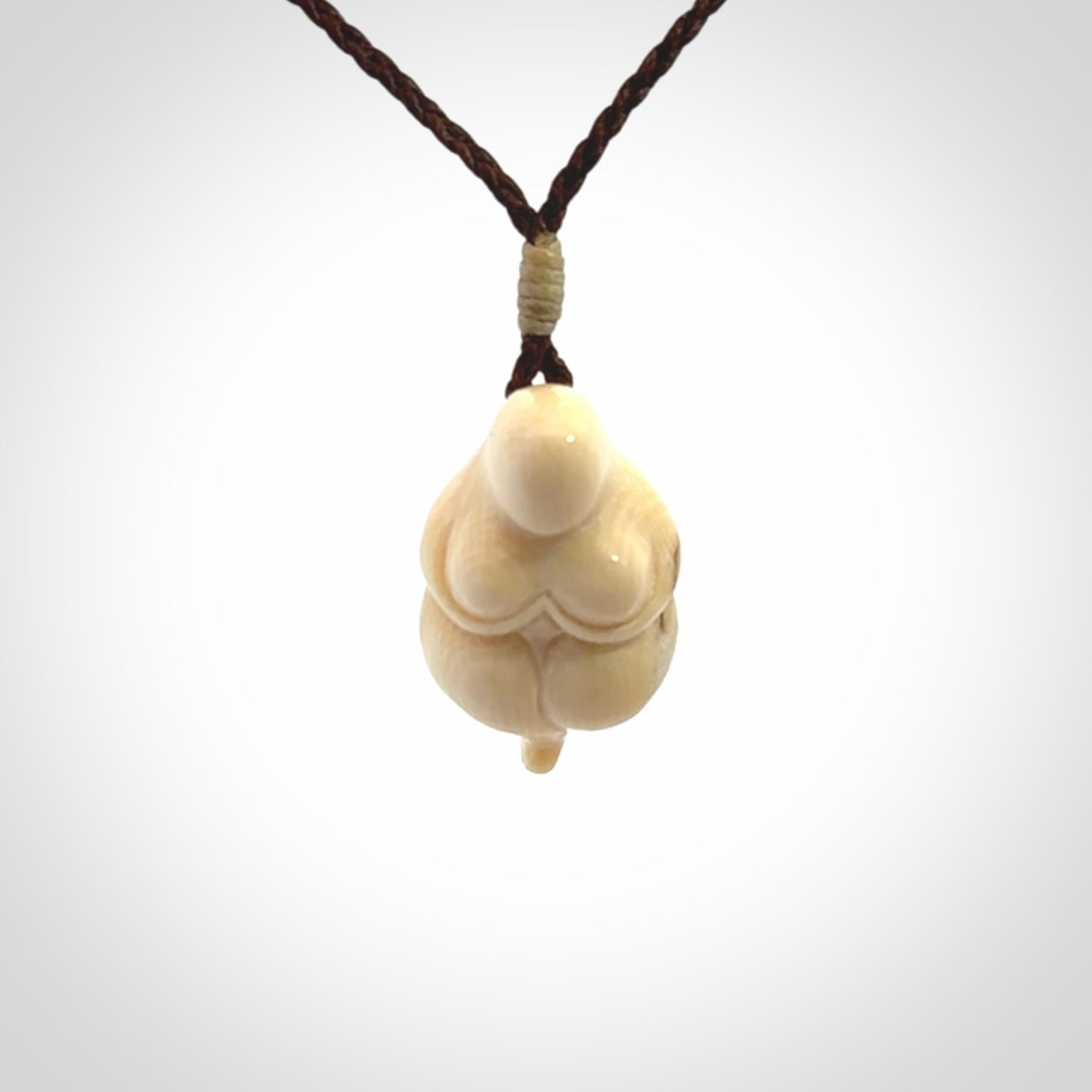 Hand carved mammoth tusk goddess pendant. Hand carved Mammoth Tusk jewellery for sale online by NZ Pacific. Delivered with a fine adjustable cord and packaged in a woven kete pouch.