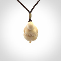 Hand carved mammoth tusk goddess pendant. Hand carved Mammoth Tusk jewellery for sale online by NZ Pacific. Delivered with a fine adjustable cord and packaged in a woven kete pouch.