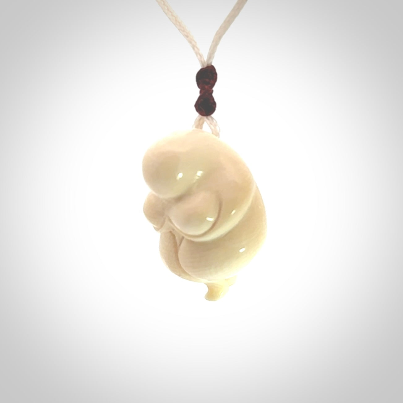 Hand carved mammoth tusk goddess pendant. Hand carved Mammoth Tusk jewellery for sale online by NZ Pacific. Delivered with a fine adjustable cord and packaged in a woven kete pouch.