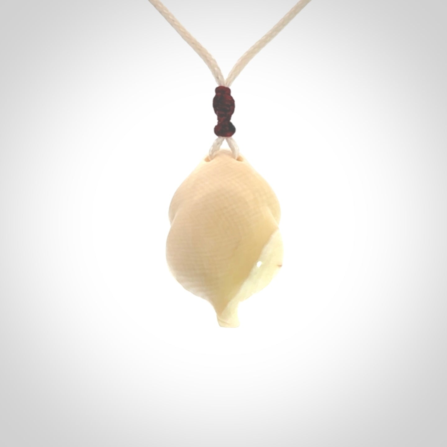 Hand carved mammoth tusk goddess pendant. Hand carved Mammoth Tusk jewellery for sale online by NZ Pacific. Delivered with a fine adjustable cord and packaged in a woven kete pouch.