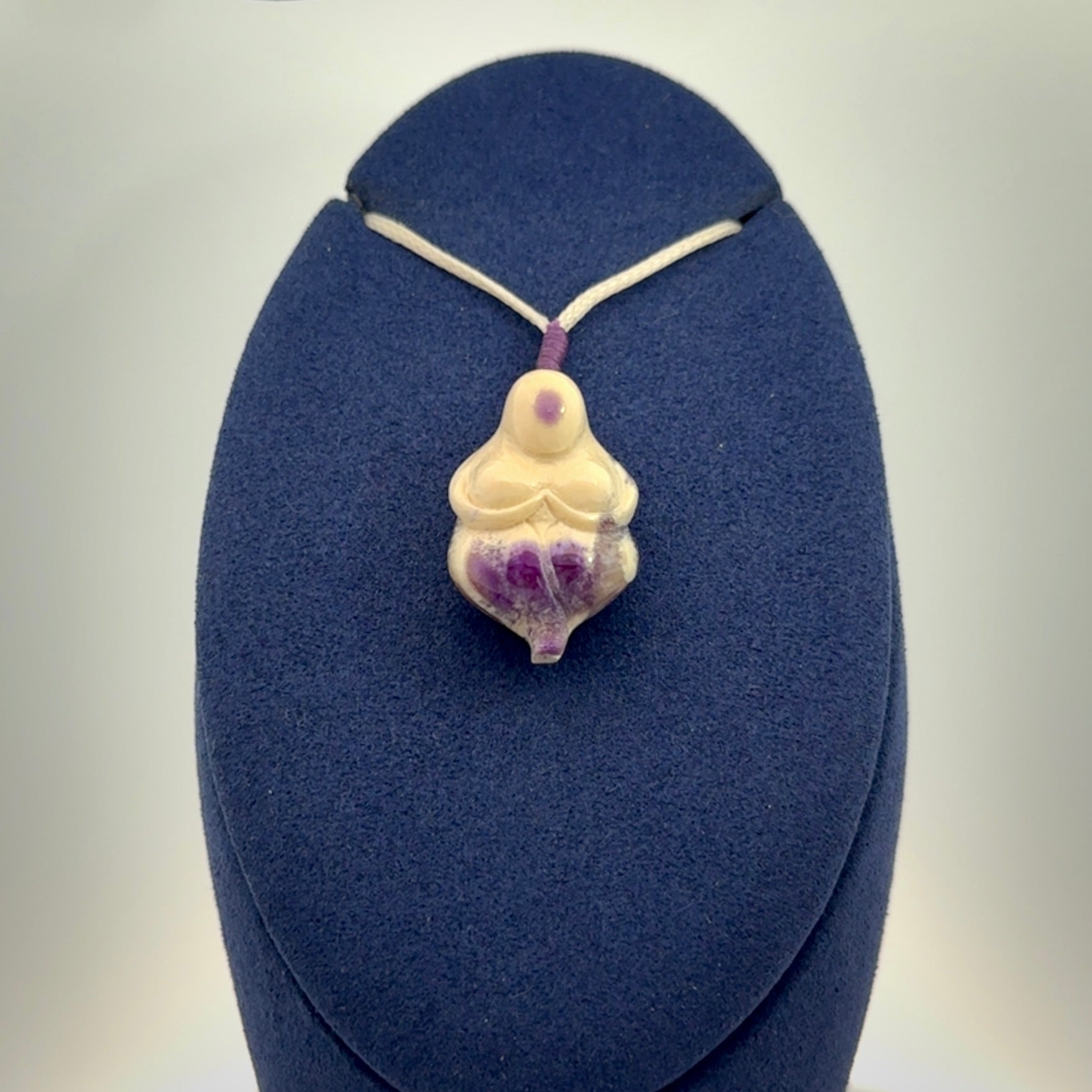 Hand carved mammoth tusk goddess pendant. Hand carved Mammoth Tusk jewellery for sale online by NZ Pacific. Delivered with a fine adjustable cord and packaged in a woven kete pouch.