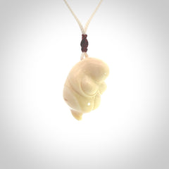 Hand carved mammoth tusk goddess pendant. Hand carved Mammoth Tusk jewellery for sale online by NZ Pacific. Delivered with a fine adjustable cord and packaged in a woven kete pouch.