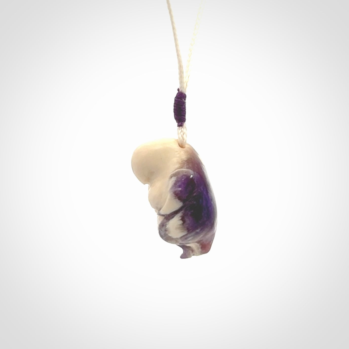 Hand carved mammoth tusk goddess pendant. Hand carved Mammoth Tusk jewellery for sale online by NZ Pacific. Delivered with a fine adjustable cord and packaged in a woven kete pouch.