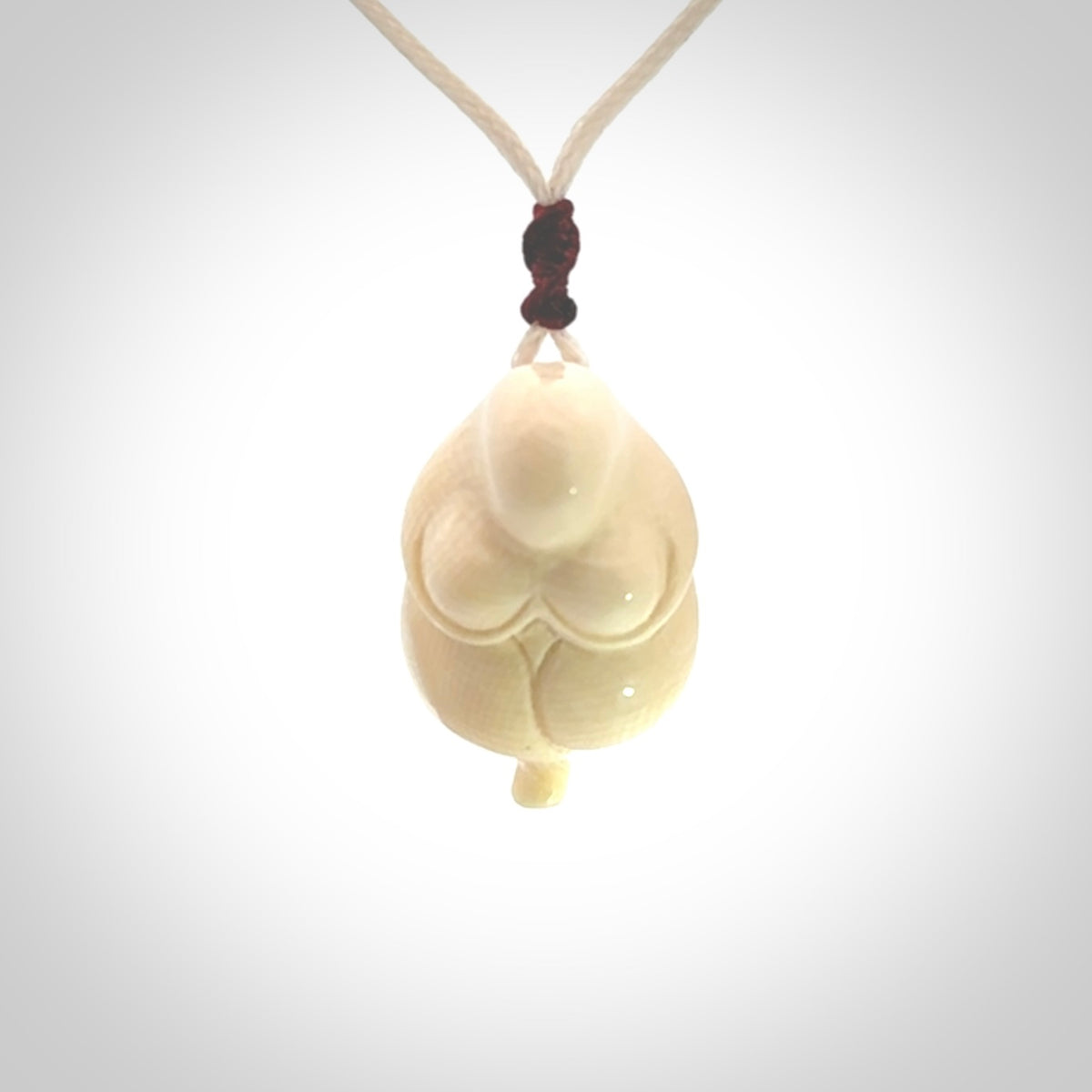 Hand carved mammoth tusk goddess pendant. Hand carved Mammoth Tusk jewellery for sale online by NZ Pacific. Delivered with a fine adjustable cord and packaged in a woven kete pouch.