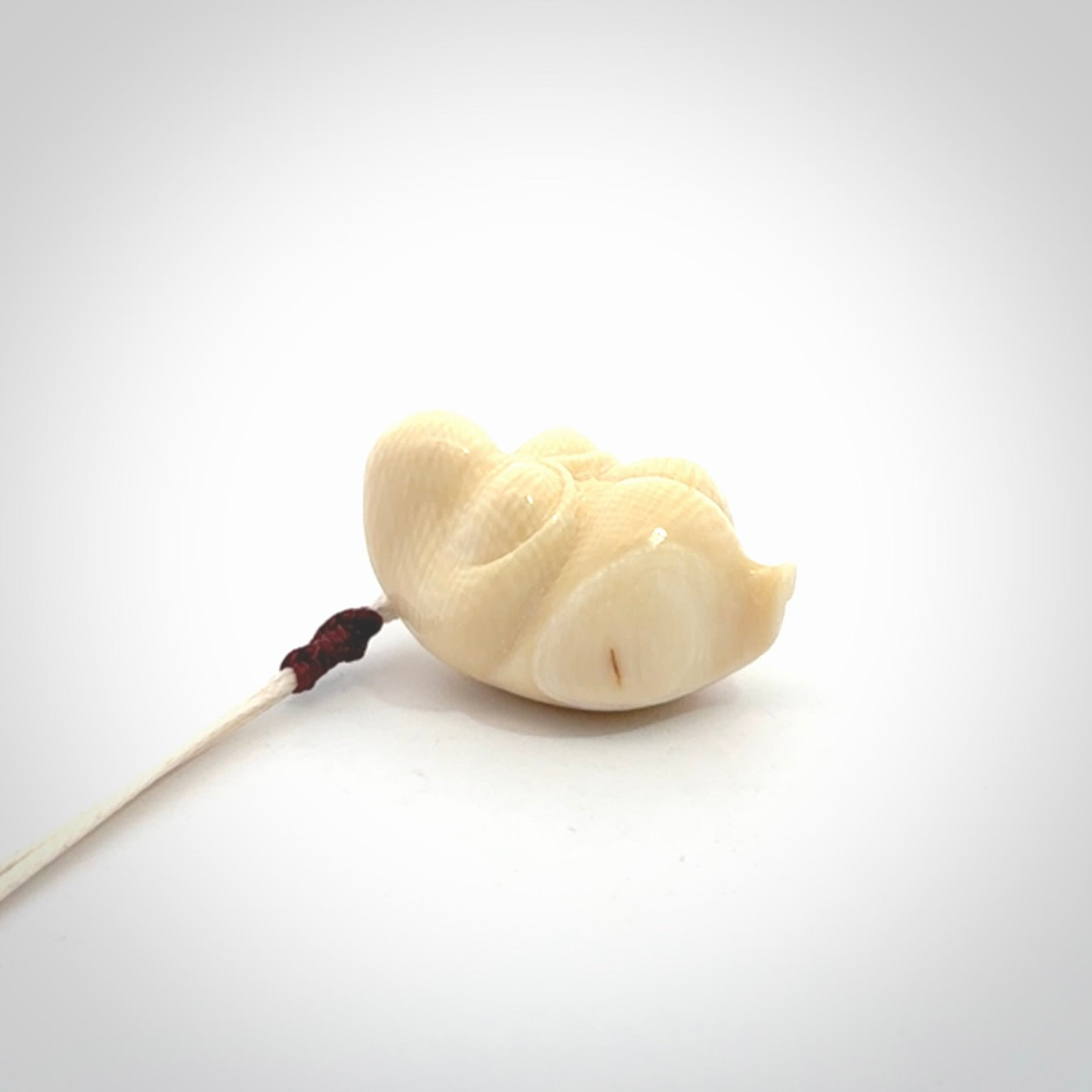 Hand carved mammoth tusk goddess pendant. Hand carved Mammoth Tusk jewellery for sale online by NZ Pacific. Delivered with a fine adjustable cord and packaged in a woven kete pouch.