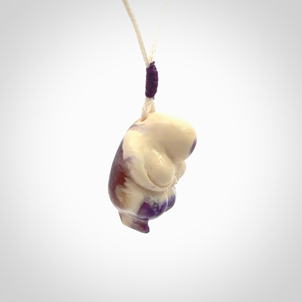 Hand carved mammoth tusk goddess pendant. Hand carved Mammoth Tusk jewellery for sale online by NZ Pacific. Delivered with a fine adjustable cord and packaged in a woven kete pouch.