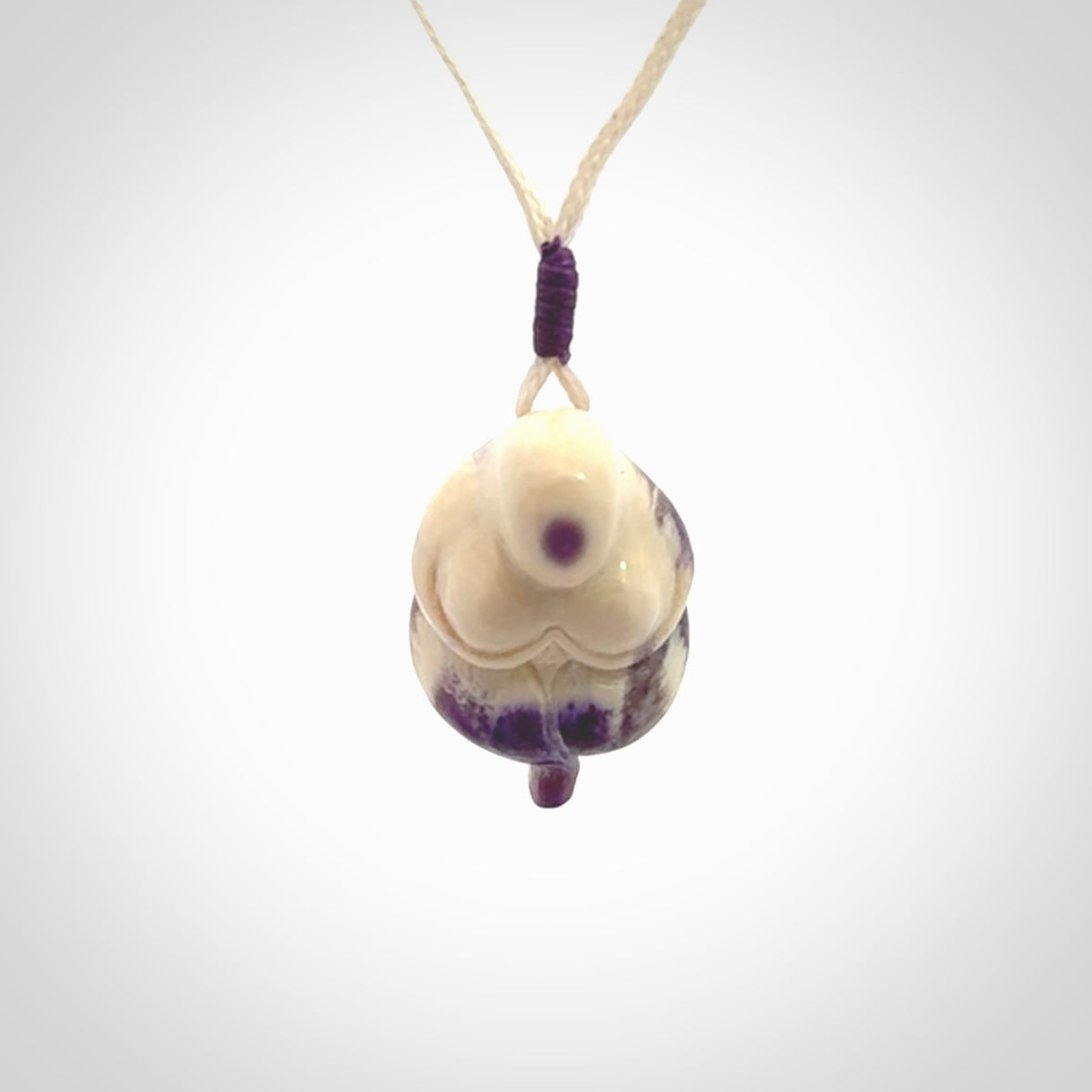 Hand carved mammoth tusk goddess pendant. Hand carved Mammoth Tusk jewellery for sale online by NZ Pacific. Delivered with a fine adjustable cord and packaged in a woven kete pouch.