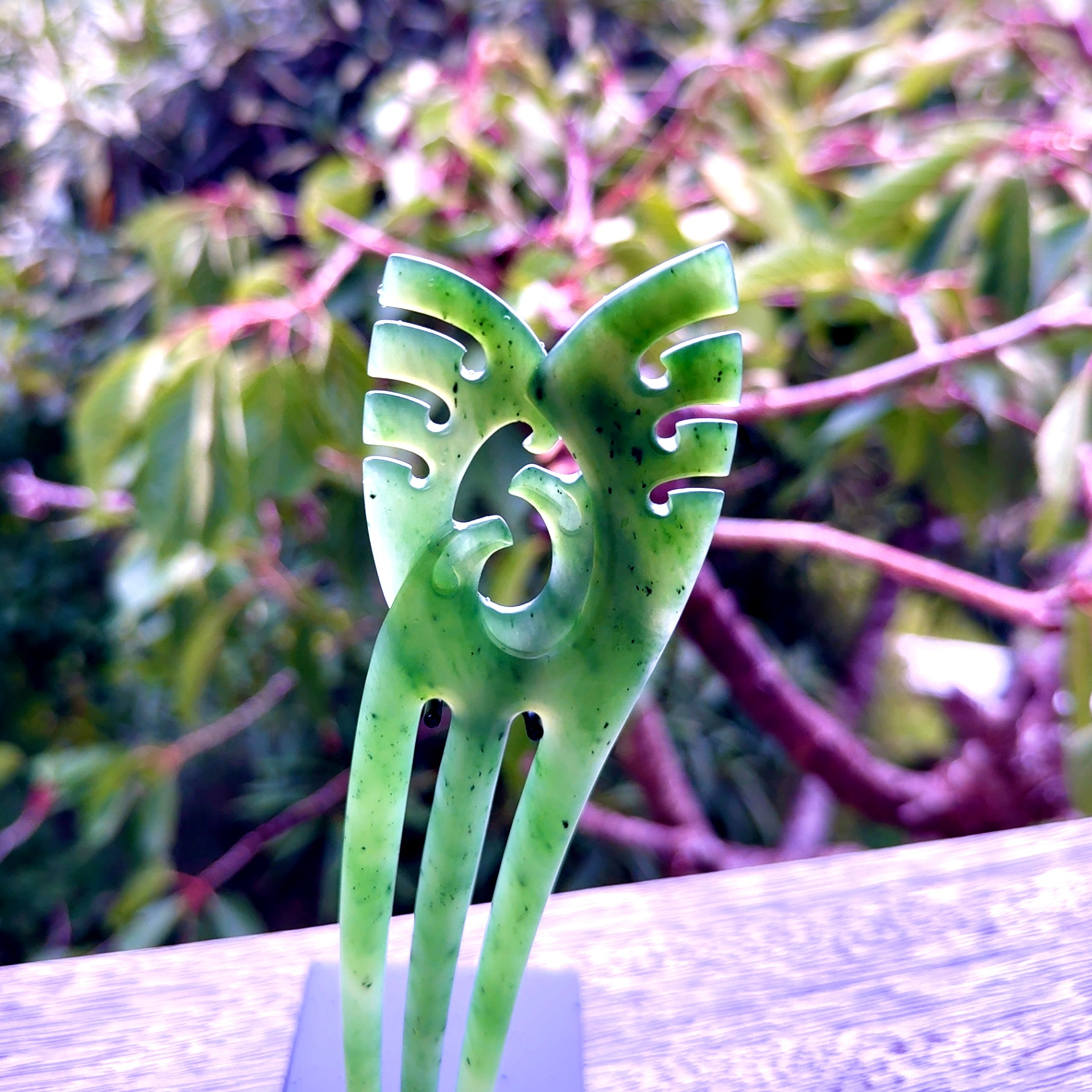 A hand carved New Zealand Jade Heru comb. A large hand made Heru comb  by New Zealand artist Kerry Thompson. Kerry has carved two Haast eagles at the top of the comb - this is an exquisite work of art and would be perfect for an enthusiasts collection.