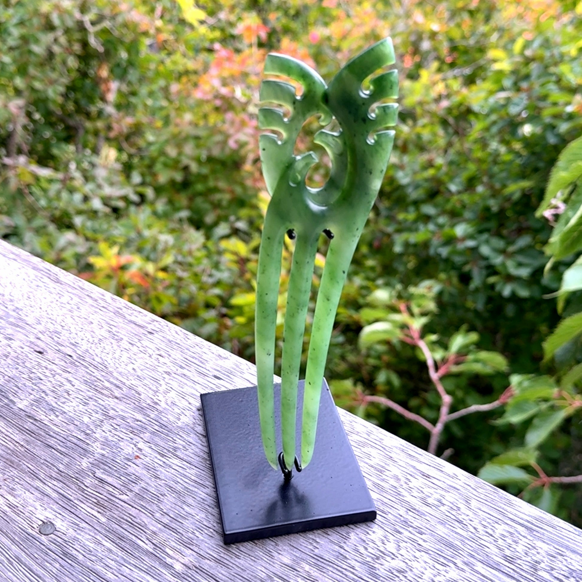A hand carved New Zealand Jade Heru comb. A large hand made Heru comb  by New Zealand artist Kerry Thompson. Kerry has carved two Haast eagles at the top of the comb - this is an exquisite work of art and would be perfect for an enthusiasts collection.