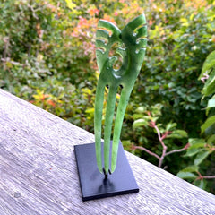 A hand carved New Zealand Jade Heru comb. A large hand made Heru comb  by New Zealand artist Kerry Thompson. Kerry has carved two Haast eagles at the top of the comb - this is an exquisite work of art and would be perfect for an enthusiasts collection.