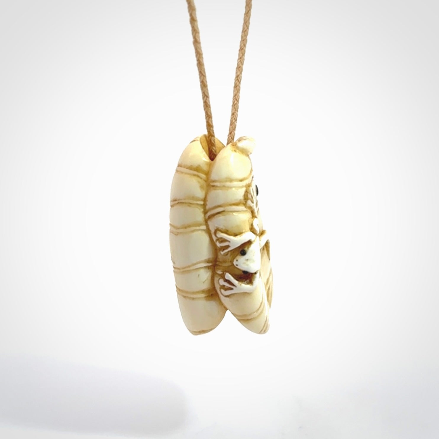 Hand carved bone frog on lotus leaf with moving crab pendant. Made from Bone in New Zealand. Made by master bone carver Fumio Noguchi. Spectacular collectable work of art, made to wear. One only pendant, delivered to you with express courier on a beige adjustable cord.