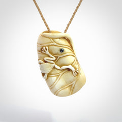 Hand carved bone frog on lotus leaf with moving crab pendant. Made from Bone in New Zealand. Made by master bone carver Fumio Noguchi. Spectacular collectable work of art, made to wear. One only pendant, delivered to you with express courier on a beige adjustable cord.