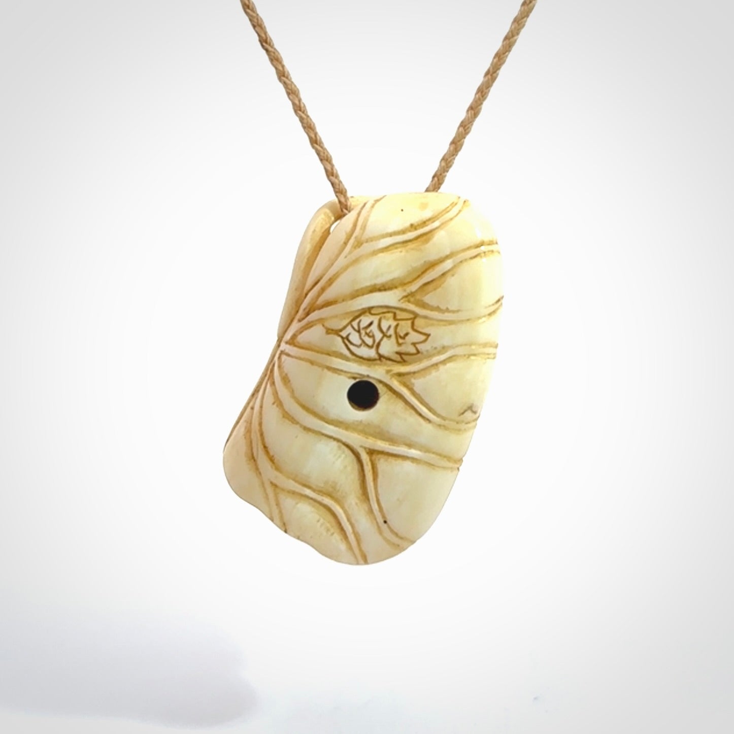 Hand carved bone frog on lotus leaf with moving crab pendant. Made from Bone in New Zealand. Made by master bone carver Fumio Noguchi. Spectacular collectable work of art, made to wear. One only pendant, delivered to you with express courier on a beige adjustable cord.