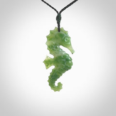 A hand carved seahorse pendant. We have carved this from beautiful nephrite jade and we bind them with our hand-plaited cords. the cords are a waxed polyester so they are durable and strong. We ship these worldwide with express courier anywhere in the world.