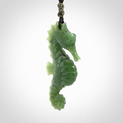 A hand carved seahorse pendant. We have carved this from beautiful nephrite jade and we bind them with our hand-plaited cords. We ship these worldwide with express courier anywhere in the world.