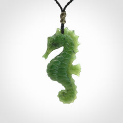 A hand carved seahorse pendant. We have carved this from beautiful nephrite jade and we bind them with our hand-plaited cords. We ship these worldwide with express courier anywhere in the world.