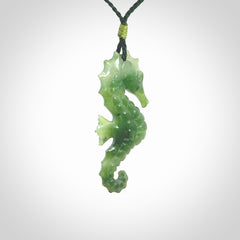 A hand carved seahorse pendant. We have carved this from beautiful nephrite jade and we bind them with our hand-plaited cords. We ship these worldwide with express courier anywhere in the world.