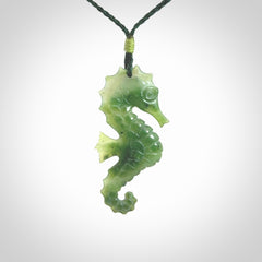 A hand carved seahorse pendant. We have carved this from beautiful nephrite jade and we bind them with our hand-plaited cords. We ship these worldwide with express courier anywhere in the world.