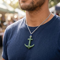 Man wearing jade anchor pendant