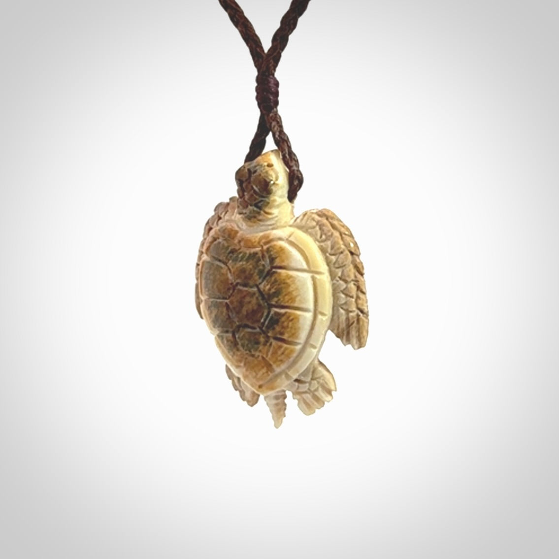 This is a beautiful hand carved woolly mammoth tusk turtle pendant. A really cool piece that is made from this rare and beautiful material. The mammoth has a very distinctive grain and each piece is different. We ship this worldwide and the cost of shipping is included in the price.