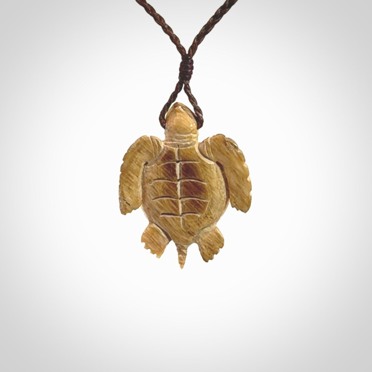 This is a beautiful hand carved woolly mammoth tusk turtle pendant. A really cool piece that is made from this rare and beautiful material. The mammoth has a very distinctive grain and each piece is different. We ship this worldwide and the cost of shipping is included in the price.