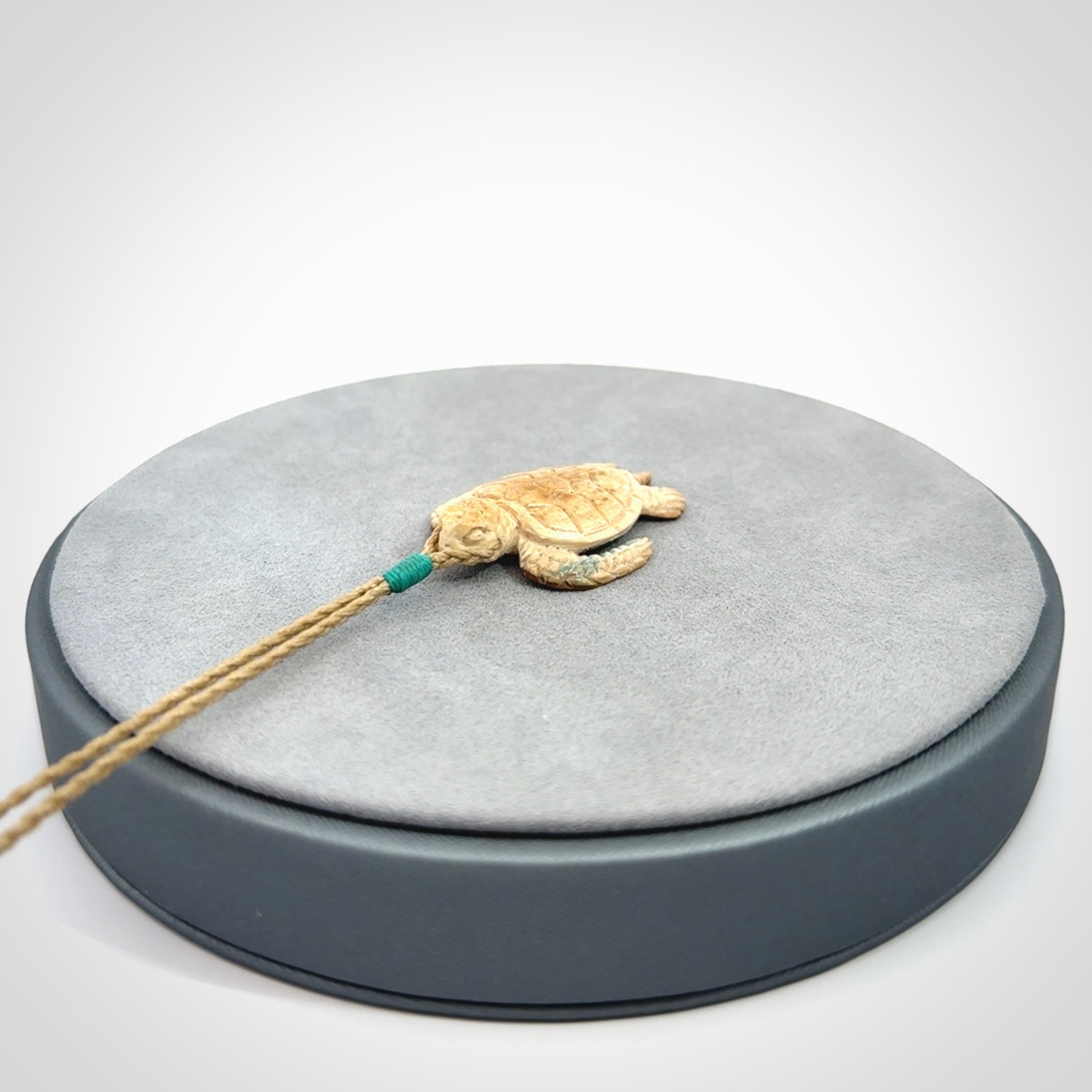This is a beautiful hand carved woolly mammoth tusk turtle pendant. A really cool piece that is made from this rare and beautiful material. The mammoth has a very distinctive grain and each piece is different. We ship this worldwide and the cost of shipping is included in the price.