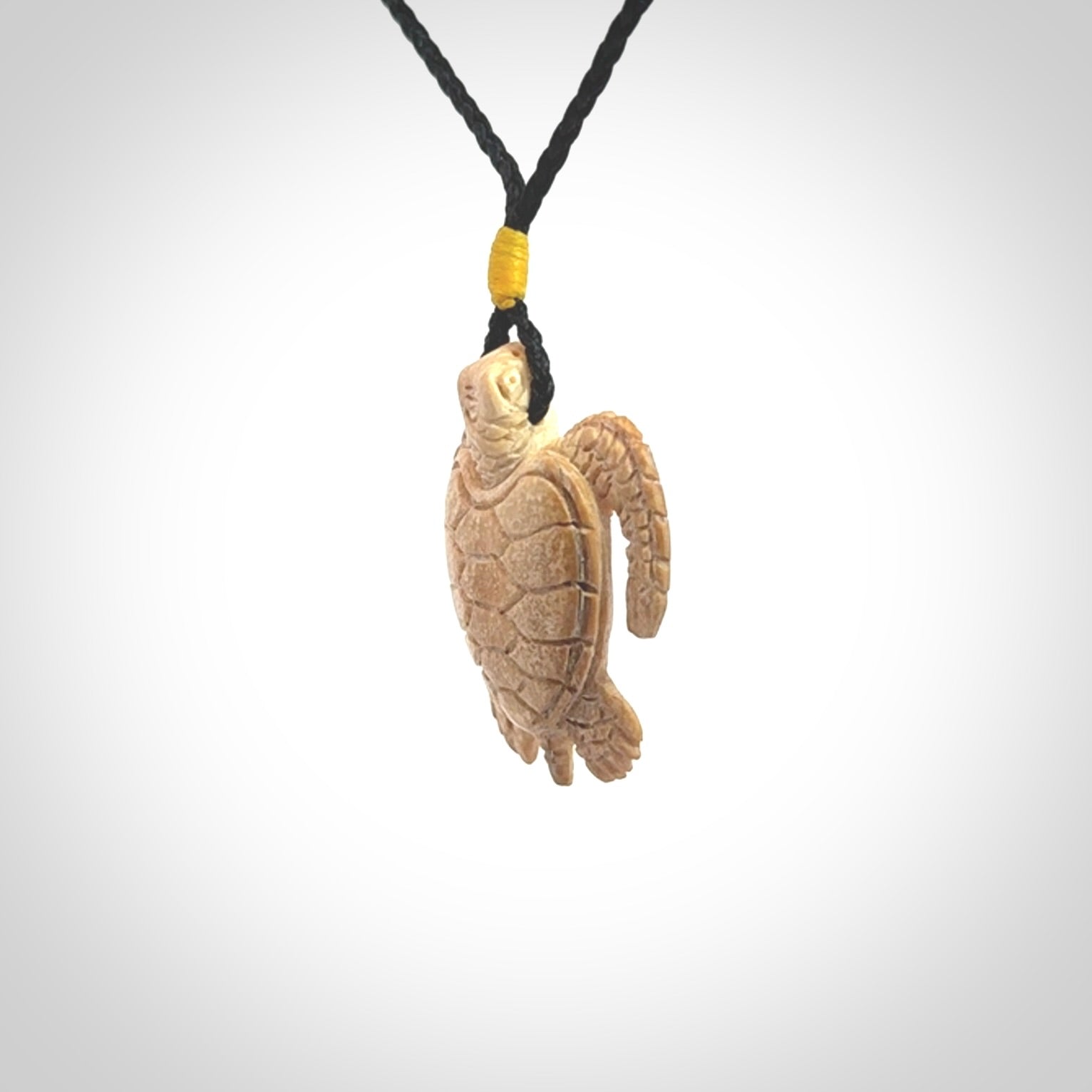 This is a beautiful hand carved woolly mammoth tusk turtle pendant. A really cool piece that is made from this rare and beautiful material. The mammoth has a very distinctive grain and each piece is different. We ship this worldwide and the cost of shipping is included in the price.