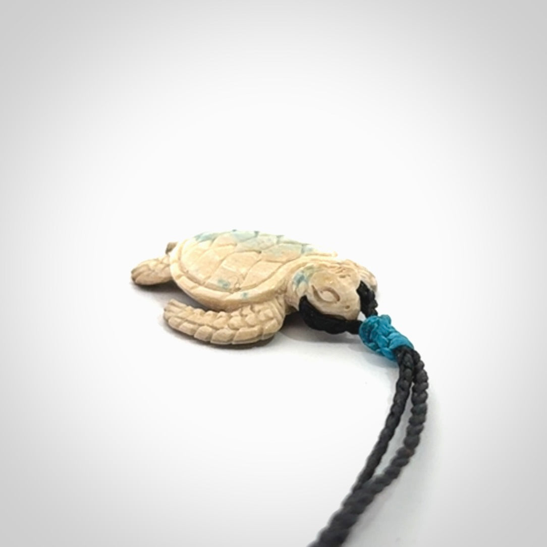 This is a beautiful hand carved woolly mammoth tusk turtle pendant. A really cool piece that is made from this rare and beautiful material. The mammoth has a very distinctive grain and each piece is different. We ship this worldwide and the cost of shipping is included in the price.