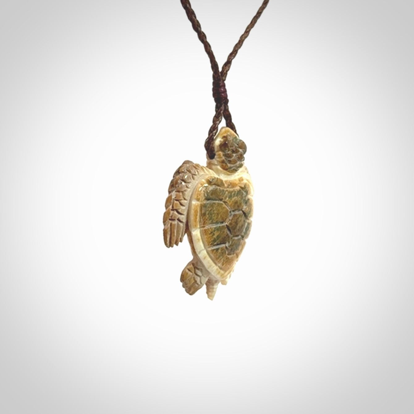This is a beautiful hand carved woolly mammoth tusk turtle pendant. A really cool piece that is made from this rare and beautiful material. The mammoth has a very distinctive grain and each piece is different. We ship this worldwide and the cost of shipping is included in the price.