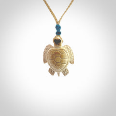 This is a beautiful hand carved woolly mammoth tusk turtle pendant. A really cool piece that is made from this rare and beautiful material. The mammoth has a very distinctive grain and each piece is different. We ship this worldwide and the cost of shipping is included in the price.