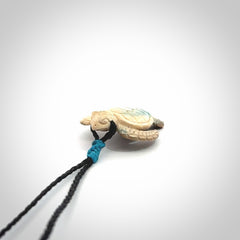 This is a beautiful hand carved woolly mammoth tusk turtle pendant. A really cool piece that is made from this rare and beautiful material. The mammoth has a very distinctive grain and each piece is different. We ship this worldwide and the cost of shipping is included in the price.