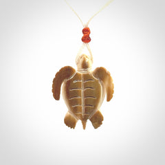 This is a beautiful hand carved woolly mammoth tusk turtle pendant. A really cool piece that is made from this rare and beautiful material. The mammoth has a very distinctive grain and each piece is different. We ship this worldwide and the cost of shipping is included in the price.