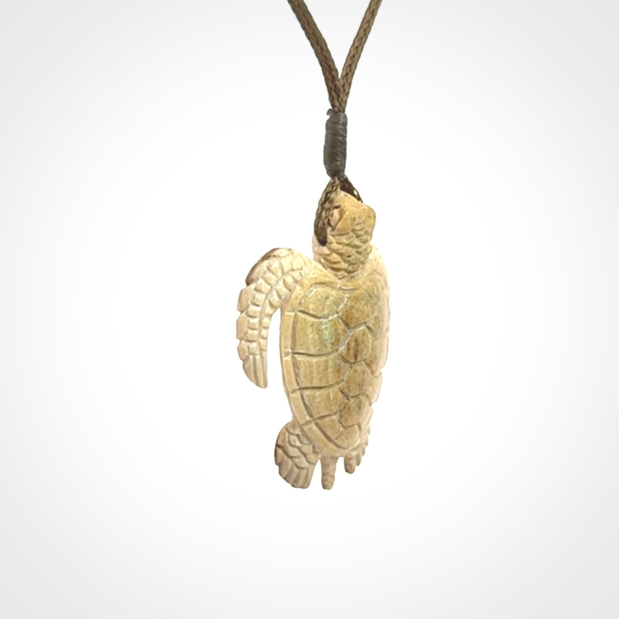This is a beautiful hand carved woolly mammoth tusk turtle pendant. A really cool piece that is made from this rare and beautiful material. The mammoth has a very distinctive grain and each piece is different. We ship this worldwide and the cost of shipping is included in the price.