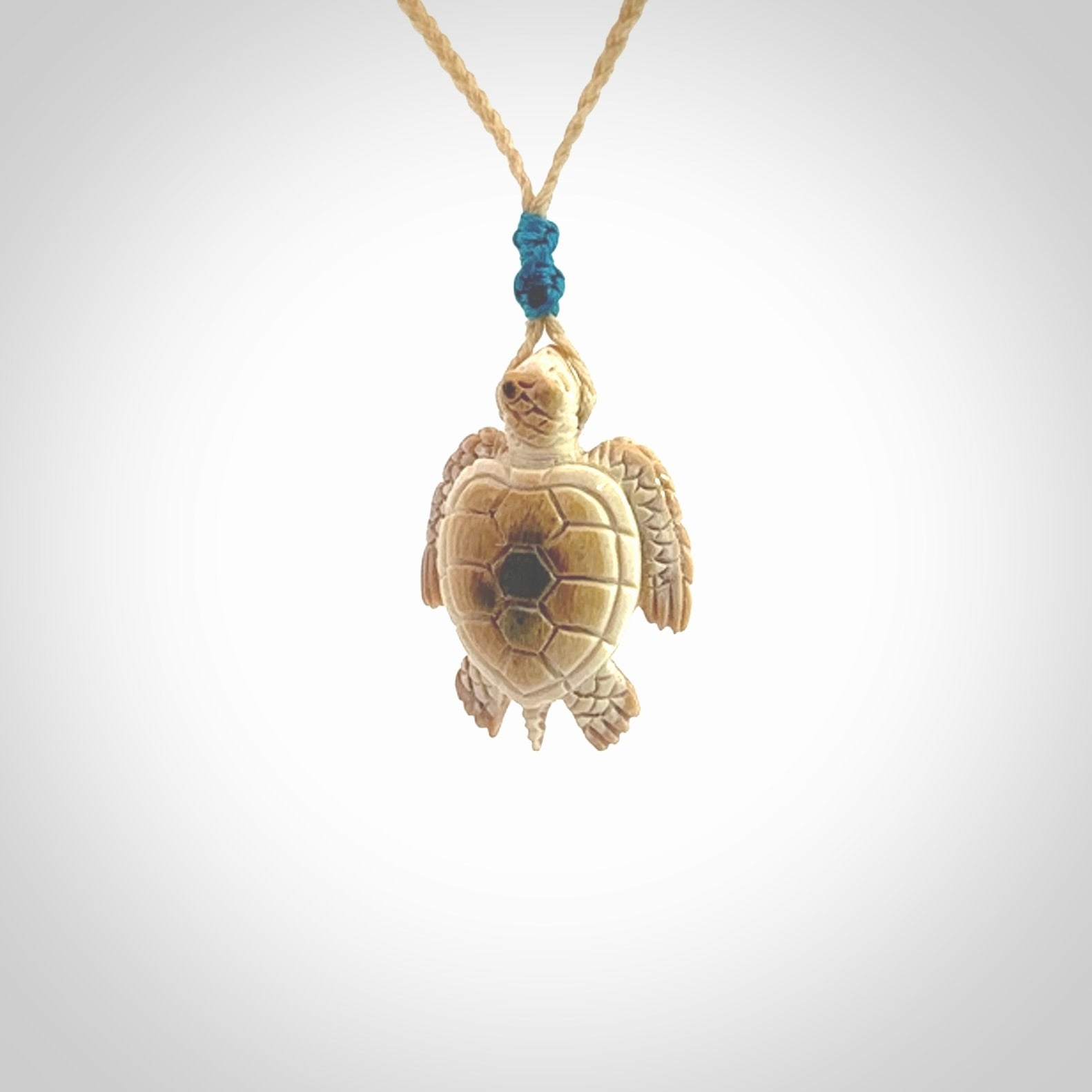 This is a beautiful hand carved woolly mammoth tusk turtle pendant. A really cool piece that is made from this rare and beautiful material. The mammoth has a very distinctive grain and each piece is different. We ship this worldwide and the cost of shipping is included in the price.