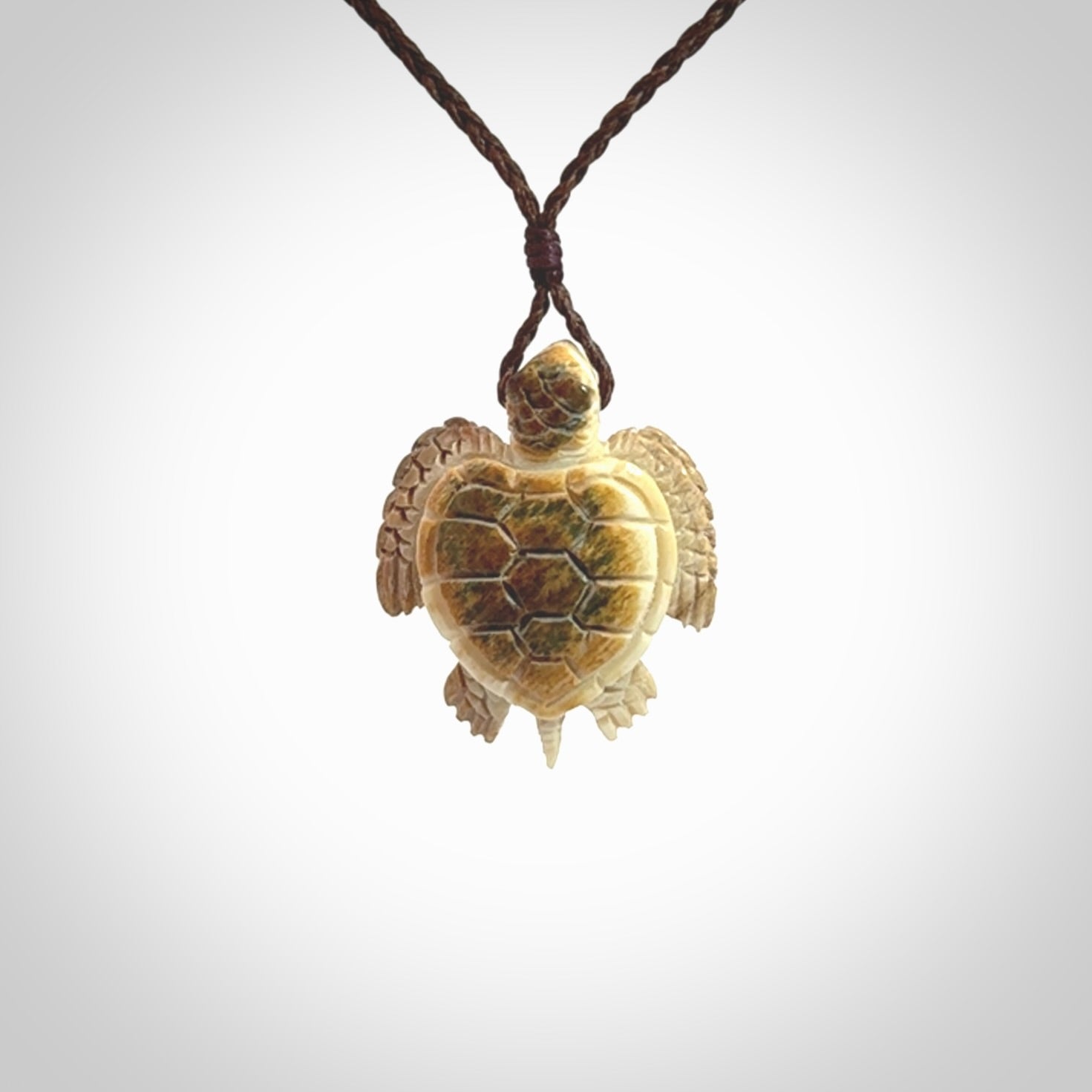 This is a beautiful hand carved woolly mammoth tusk turtle pendant. A really cool piece that is made from this rare and beautiful material. The mammoth has a very distinctive grain and each piece is different. We ship this worldwide and the cost of shipping is included in the price.