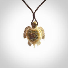 This is a beautiful hand carved woolly mammoth tusk turtle pendant. A really cool piece that is made from this rare and beautiful material. The mammoth has a very distinctive grain and each piece is different. We ship this worldwide and the cost of shipping is included in the price.