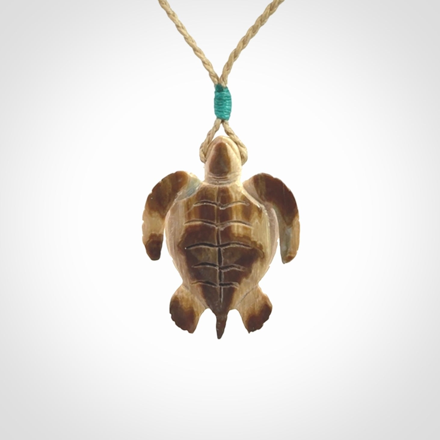 This is a beautiful hand carved woolly mammoth tusk turtle pendant. A really cool piece that is made from this rare and beautiful material. The mammoth has a very distinctive grain and each piece is different. We ship this worldwide and the cost of shipping is included in the price.