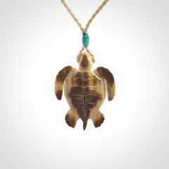 This is a beautiful hand carved woolly mammoth tusk turtle pendant. A really cool piece that is made from this rare and beautiful material. The mammoth has a very distinctive grain and each piece is different. We ship this worldwide and the cost of shipping is included in the price.