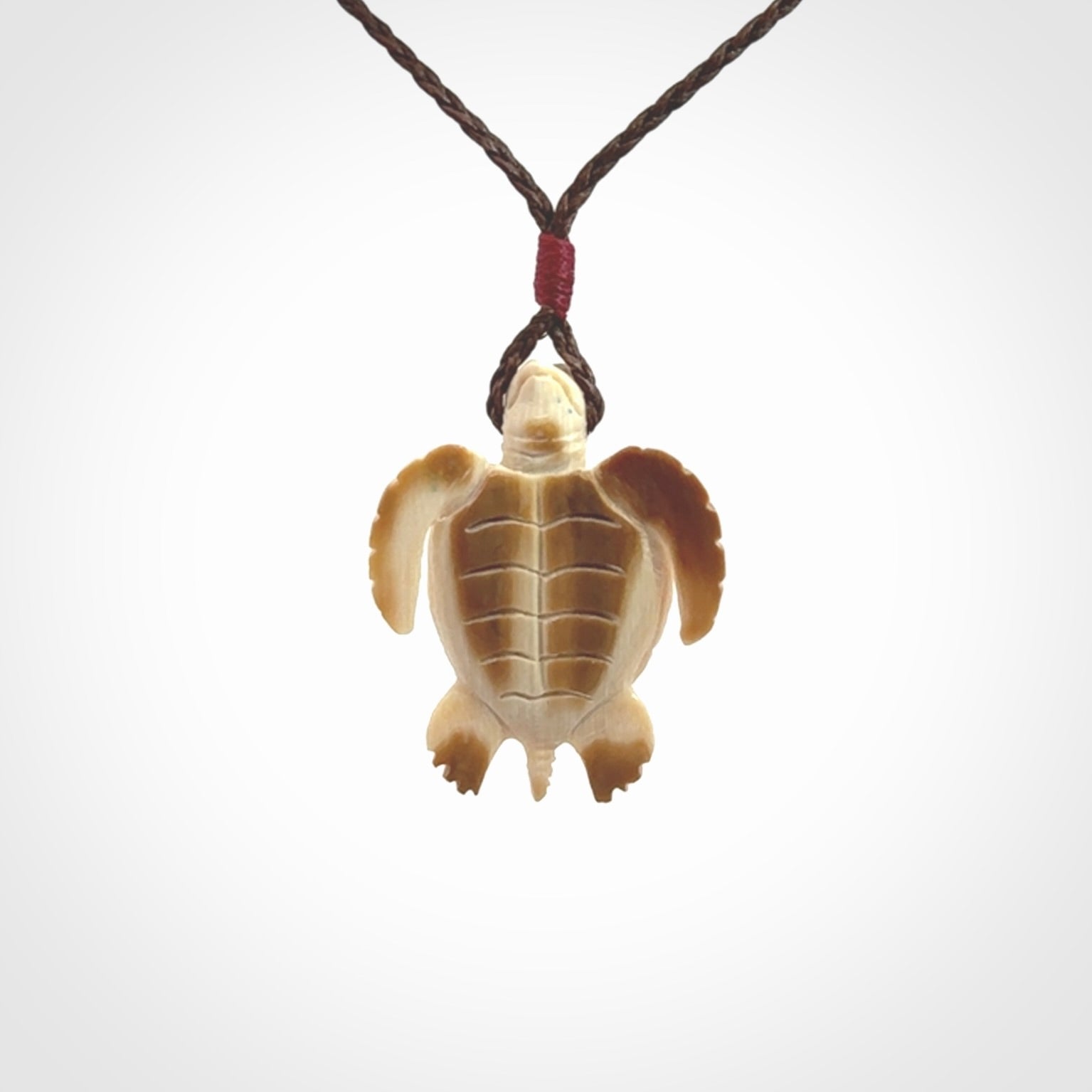 This is a beautiful hand carved woolly mammoth tusk turtle pendant. A really cool piece that is made from this rare and beautiful material. The mammoth has a very distinctive grain and each piece is different. We ship this worldwide and the cost of shipping is included in the price.