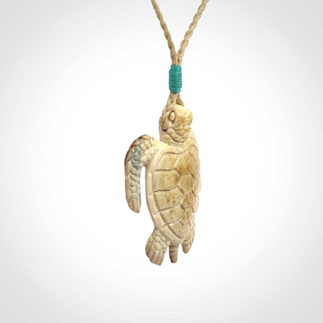 This is a beautiful hand carved woolly mammoth tusk turtle pendant. A really cool piece that is made from this rare and beautiful material. The mammoth has a very distinctive grain and each piece is different. We ship this worldwide and the cost of shipping is included in the price.