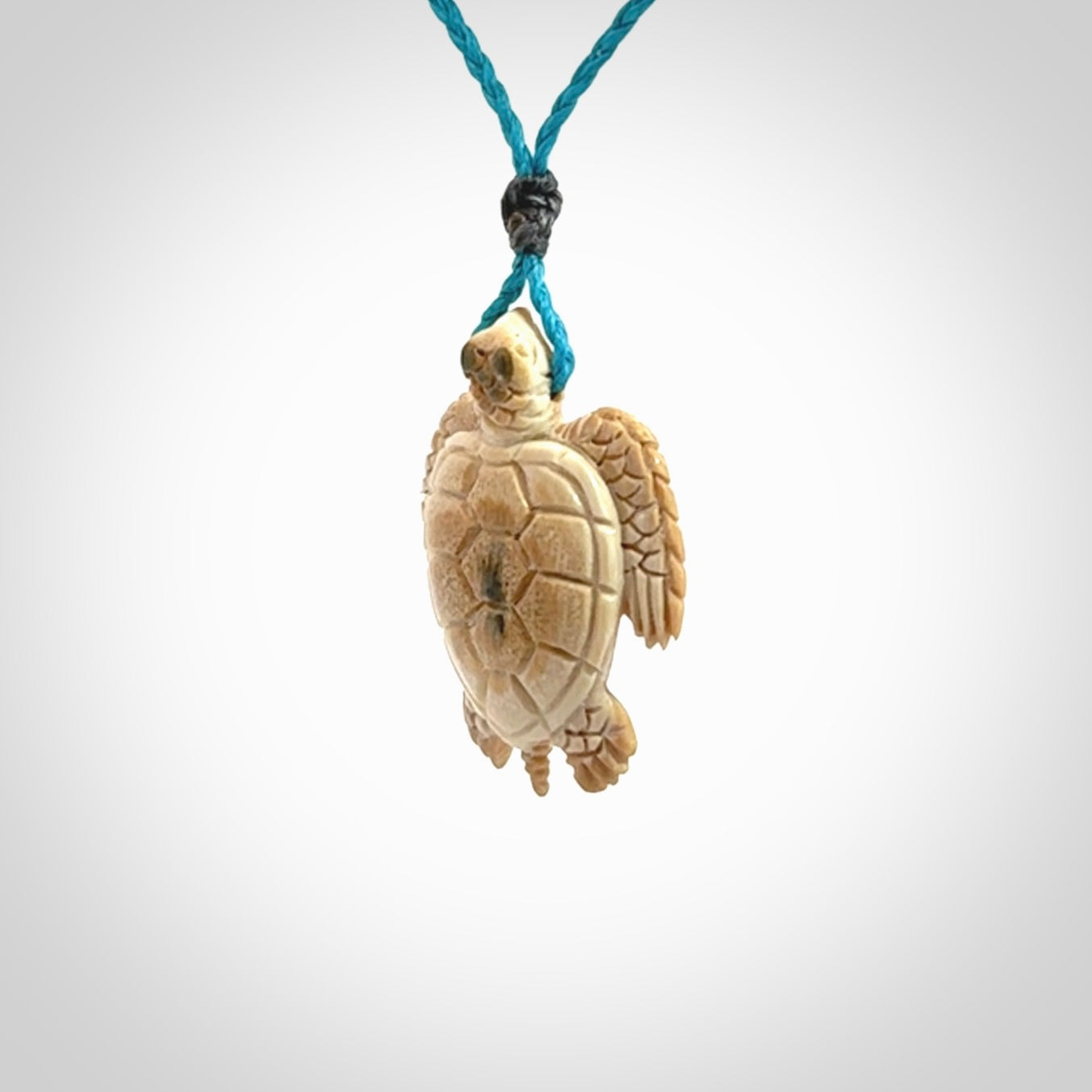 This is a beautiful hand carved woolly mammoth tusk turtle pendant. A really cool piece that is made from this rare and beautiful material. The mammoth has a very distinctive grain and each piece is different. We ship this worldwide and the cost of shipping is included in the price.
