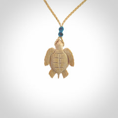 This is a beautiful hand carved woolly mammoth tusk turtle pendant. A really cool piece that is made from this rare and beautiful material. The mammoth has a very distinctive grain and each piece is different. We ship this worldwide and the cost of shipping is included in the price.