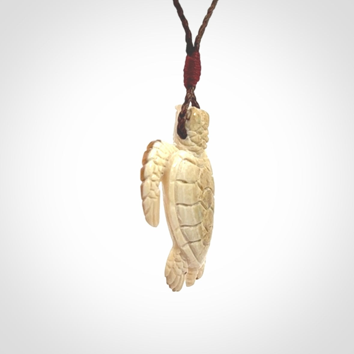 This is a beautiful hand carved woolly mammoth tusk turtle pendant. A really cool piece that is made from this rare and beautiful material. The mammoth has a very distinctive grain and each piece is different. We ship this worldwide and the cost of shipping is included in the price.