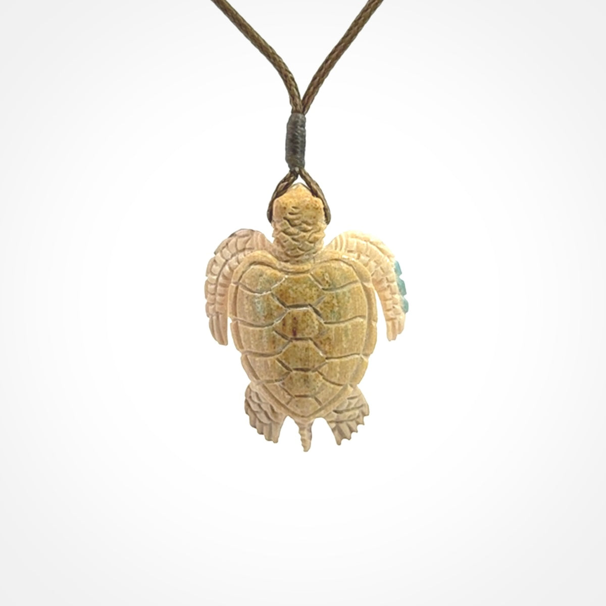 This is a beautiful hand carved woolly mammoth tusk turtle pendant. A really cool piece that is made from this rare and beautiful material. The mammoth has a very distinctive grain and each piece is different. We ship this worldwide and the cost of shipping is included in the price.