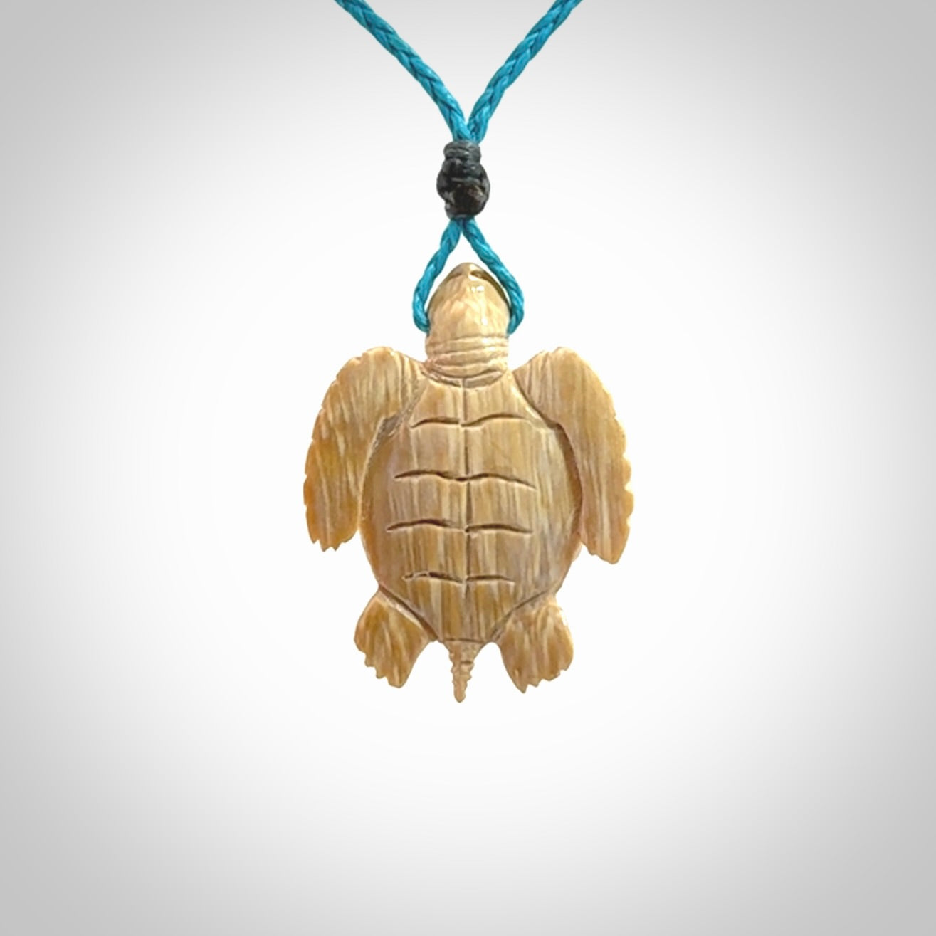 This is a beautiful hand carved woolly mammoth tusk turtle pendant. A really cool piece that is made from this rare and beautiful material. The mammoth has a very distinctive grain and each piece is different. We ship this worldwide and the cost of shipping is included in the price.