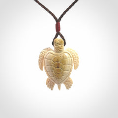 This is a beautiful hand carved woolly mammoth tusk turtle pendant. A really cool piece that is made from this rare and beautiful material. The mammoth has a very distinctive grain and each piece is different. We ship this worldwide and the cost of shipping is included in the price.