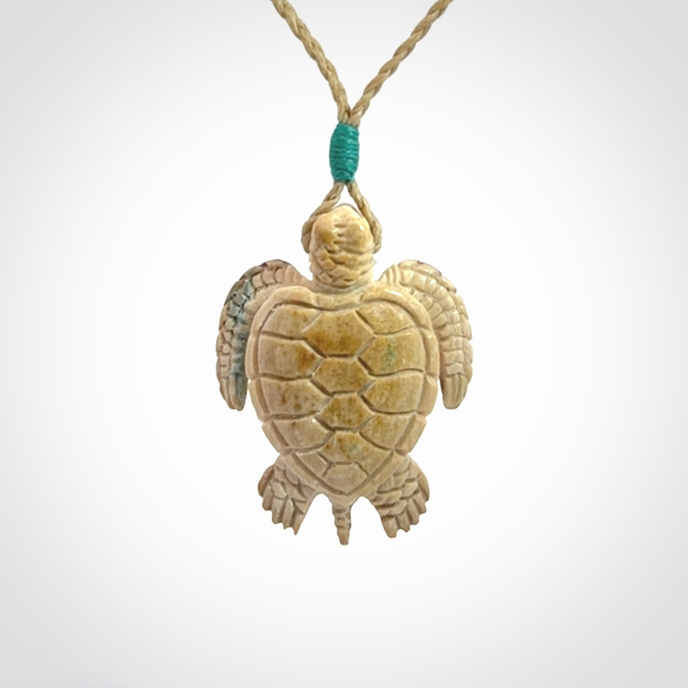 This is a beautiful hand carved woolly mammoth tusk turtle pendant. A really cool piece that is made from this rare and beautiful material. The mammoth has a very distinctive grain and each piece is different. We ship this worldwide and the cost of shipping is included in the price.