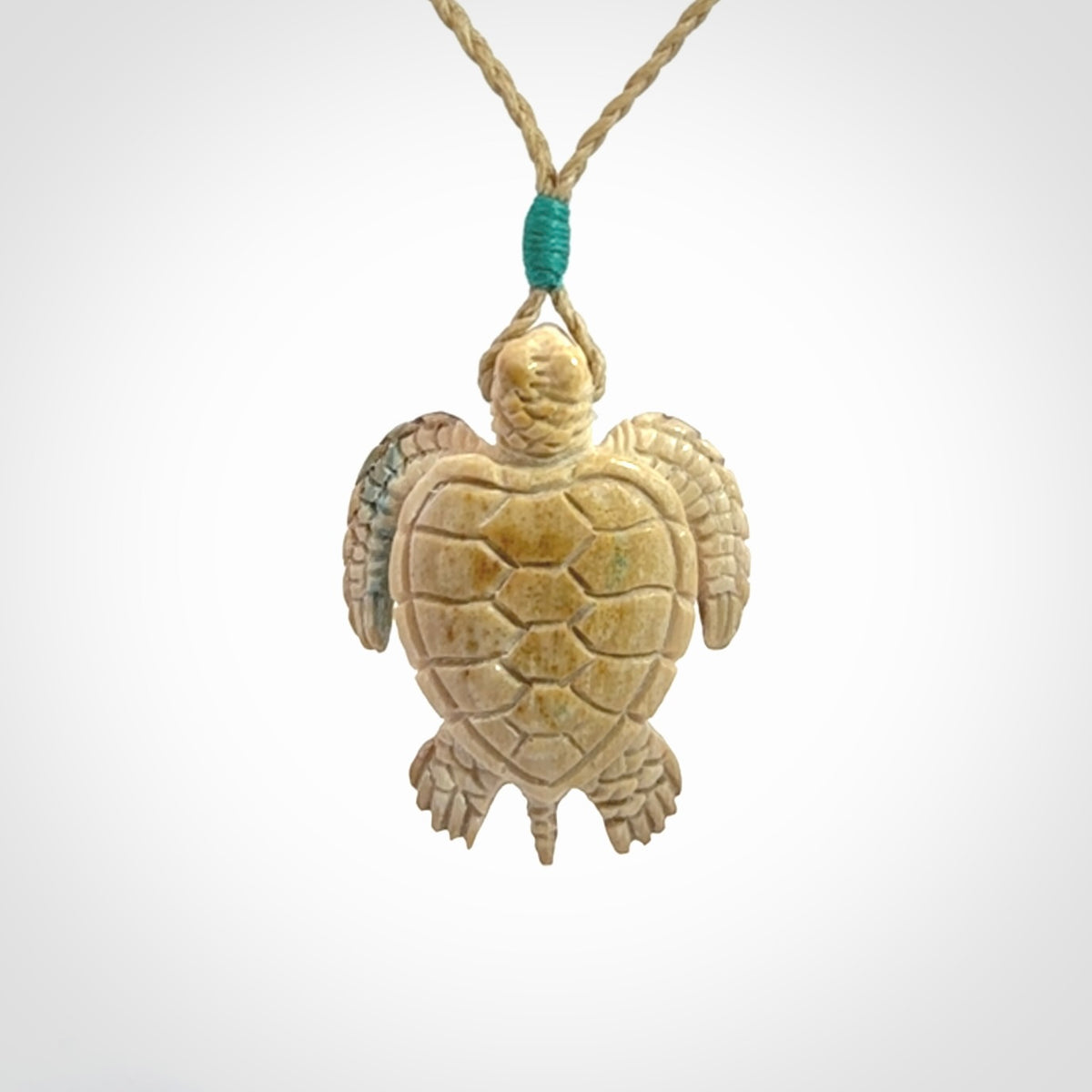 This is a beautiful hand carved woolly mammoth tusk turtle pendant. A really cool piece that is made from this rare and beautiful material. The mammoth has a very distinctive grain and each piece is different. We ship this worldwide and the cost of shipping is included in the price.