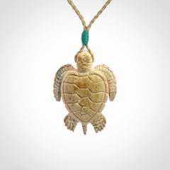 This is a beautiful hand carved woolly mammoth tusk turtle pendant. A really cool piece that is made from this rare and beautiful material. The mammoth has a very distinctive grain and each piece is different. We ship this worldwide and the cost of shipping is included in the price.
